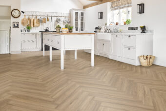 View of Smoke 5076010 (Universal 55 Herringbone) luxury vinyl tile by Victoria Design Floors