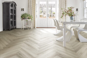 View of Fawn 5076027 (Universal 55 Herringbone) luxury vinyl tile by Victoria Design Floors