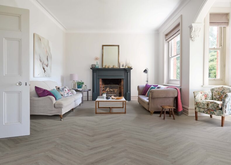 View of Flint Grey 5076201 (Universal 55 Herringbone) luxury vinyl tile by Victoria Design Floors