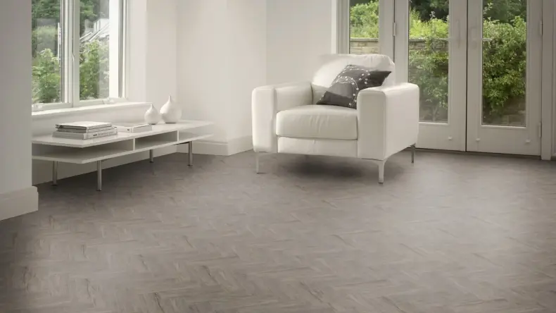 View of Native Grey Wood in Small Parquet luxury vinyl tile by Amtico