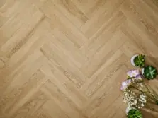 View of Sandy Oak (Herringbone) luxury vinyl tile by Elements Inspirations