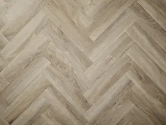 View of Limed Oak (Herringbone) luxury vinyl tile by Elements Inspirations