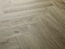 View of Dove Oak (Herringbone) luxury vinyl tile by Elements Inspirations