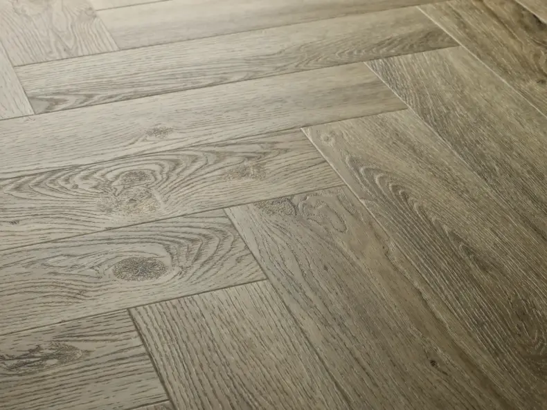 View of Dove Oak (Herringbone) luxury vinyl tile by Elements Inspirations