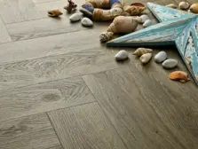 View of Dove Oak (Herringbone) luxury vinyl tile by Elements Inspirations