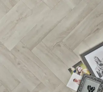 View of White Ash (Herringbone) luxury vinyl tile by Elements Inspirations