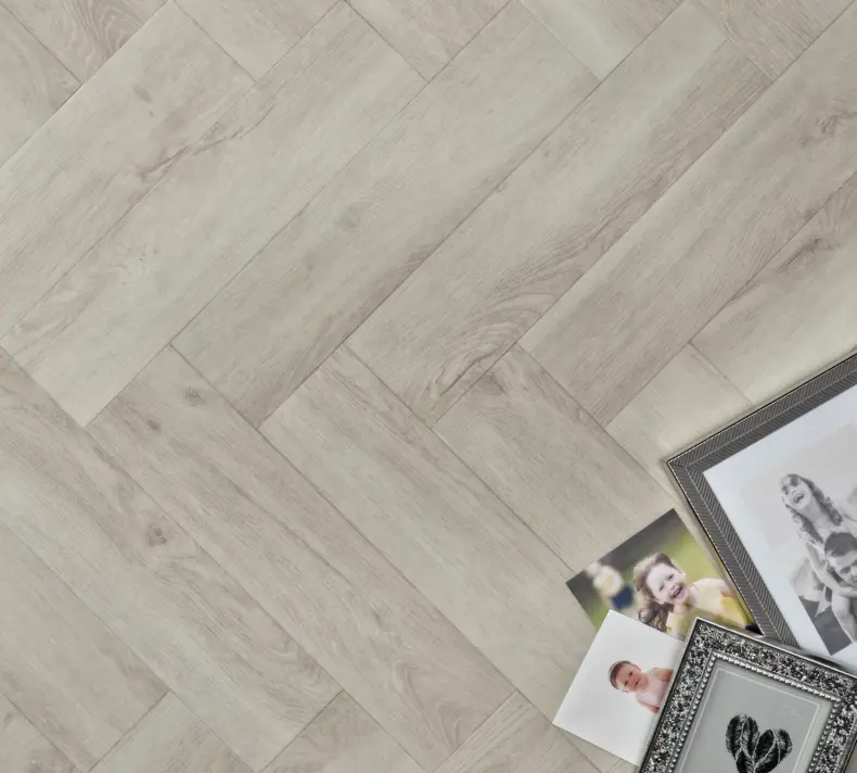 View of White Ash (Herringbone) luxury vinyl tile by Elements Inspirations
