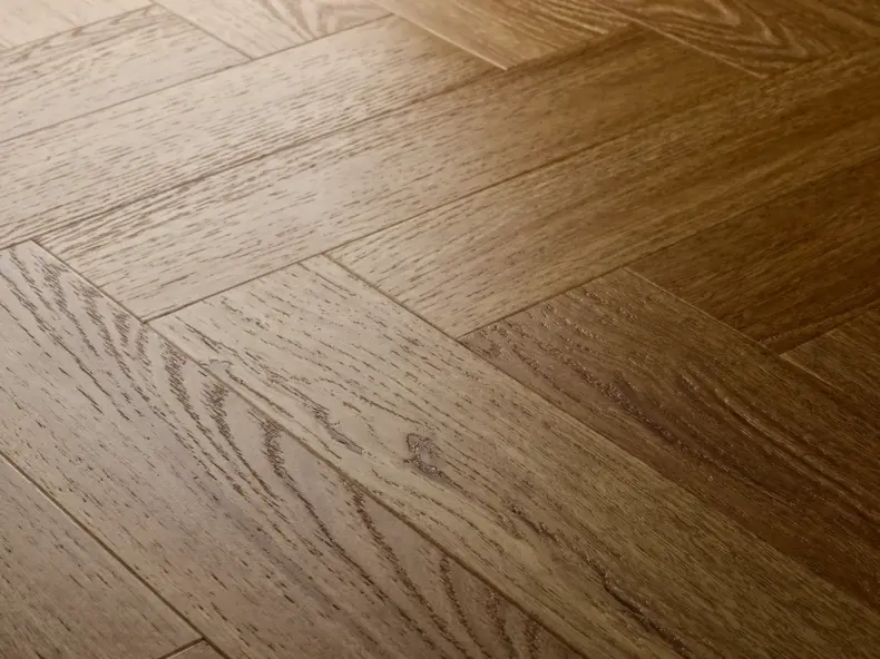 View of Golden Oak (Herringbone) luxury vinyl tile by Elements Inspirations