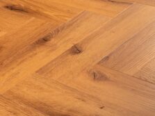 View of Honey Oak (Herringbone) luxury vinyl tile by Textures LVT