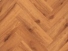 View of Honey Oak (Herringbone) luxury vinyl tile by Textures LVT