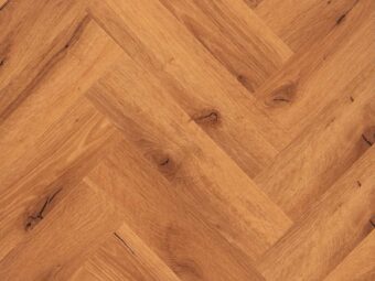View of Honey Oak (Herringbone) luxury vinyl tile by Textures LVT