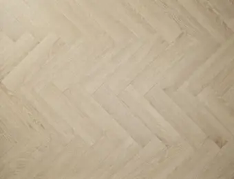 View of Blonde Oak (Herringbone) luxury vinyl tile by Textures LVT