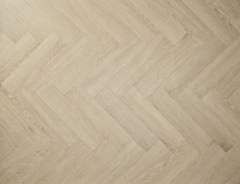View of Blonde Oak (Herringbone) luxury vinyl tile by Textures LVT