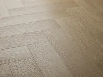 View of Blonde Oak (Herringbone) luxury vinyl tile by Textures LVT