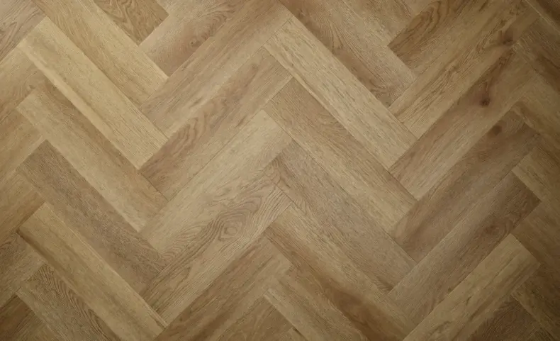 View of Summer Oak (Herringbone) luxury vinyl tile by Textures LVT