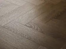 View of Cottage Oak (Herringbone) luxury vinyl tile by Textures LVT