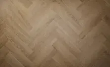 View of Cottage Oak (Herringbone) luxury vinyl tile by Textures LVT