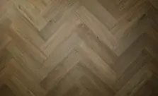 View of Aged Oak (Herringbone) luxury vinyl tile by Textures LVT