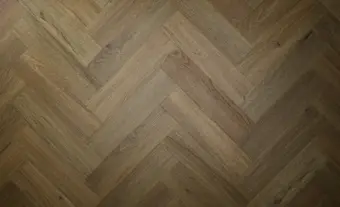 View of Aged Oak (Herringbone) luxury vinyl tile by Textures LVT