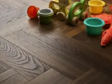 View of Warm Walnut (Herringbone) luxury vinyl tile by Textures LVT