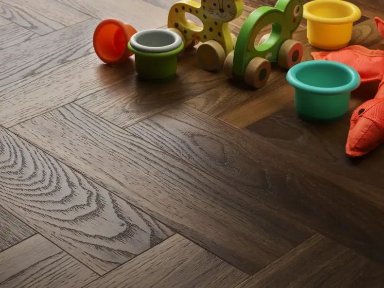 View of Warm Walnut (Herringbone) luxury vinyl tile by Textures LVT