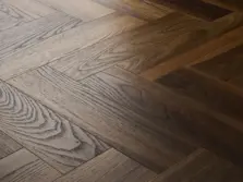 View of Warm Walnut (Herringbone) luxury vinyl tile by Textures LVT