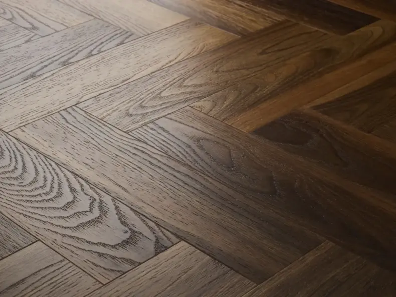 View of Warm Walnut (Herringbone) luxury vinyl tile by Textures LVT