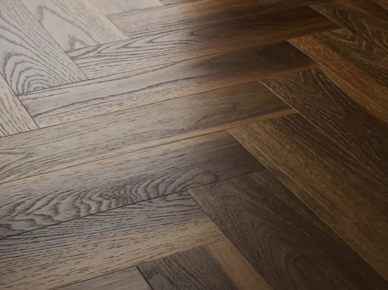View of Warm Walnut (Herringbone) luxury vinyl tile by Textures LVT