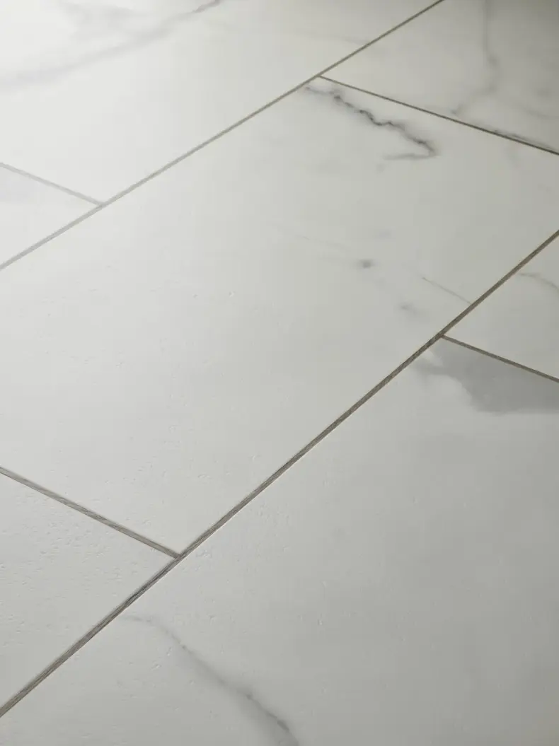 View of Carrera White (Stone) luxury vinyl tile by Textures LVT
