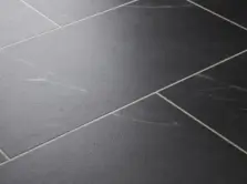 View of Carrera Dark (Stone) luxury vinyl tile by Textures LVT