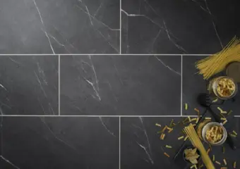 View of Carrera Dark (Stone) luxury vinyl tile by Textures LVT