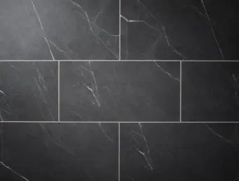 View of Carrera Dark (Stone) luxury vinyl tile by Textures LVT